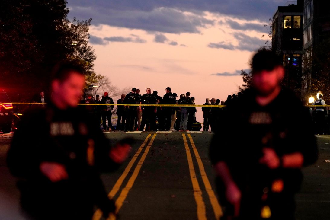 Emergency personnel keep a presence following the shooting of two National Guard soldiers near the White House on Wednesday, in Washington.