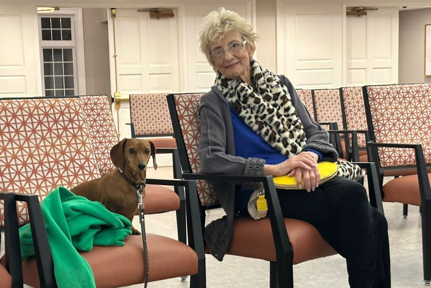 Cathy DePino listens to her daughter sing and play piano at an independent living complex.
